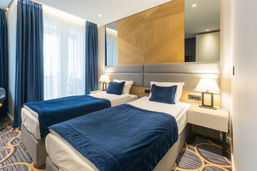 Interior of a modern luxury hotel double bed bedroom