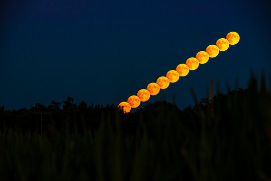 Composite photo of the full moon rising
