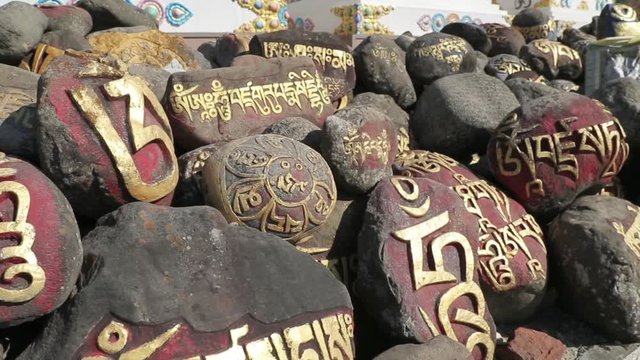 Pray stones in front of Buddhism monastery in Indian Tibet colony 