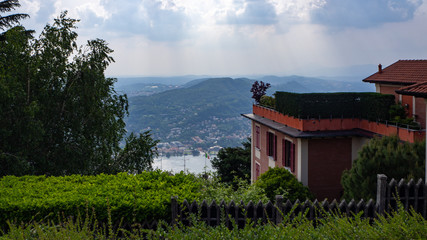 Fototapeta na wymiar View of Lake Como in cloudy day with the buildings of Bellagio, a charming tourist village