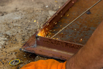 Fastening parts of metal under high temperature using a short circuit. Welding work on the metal.