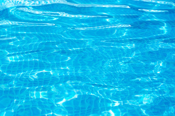 Obraz premium background of bright blue clear water in the pool