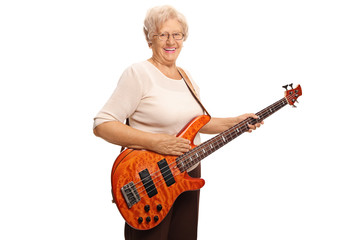 Smiling elderly woman with a bass guitar