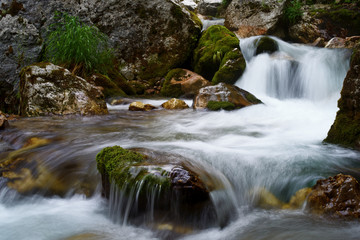 Fototapeta na wymiar Running water in the falls of Moznica Bovec
