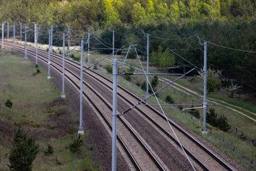 Fototapeta na wymiar Electric railway traction in the forest