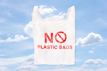 Plastic bag with "No Plastic bags" screen printing. Isolated on blue sky background