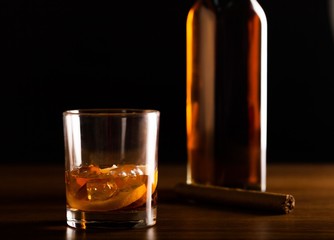 Glass of Whiskey with Bottle and Cigar