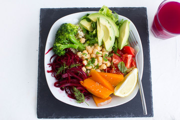 A healthy vegan salad with avocado and chickpeas