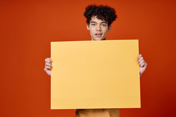 young man holding blank sign