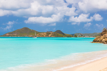 Panorama picture of whity sandy beach and turquoise waters on carrebian island of St. Maarten