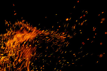 flame of fire with sparks on a black background