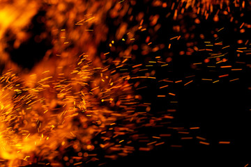 flame of fire with sparks on a black background