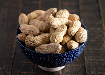 Raw In Shell Peanuts on a Wooden Kitchen Table