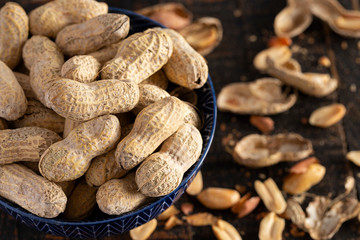 Raw In Shell Peanuts on a Wooden Kitchen Table