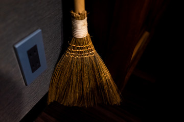 Traditional japanese house or ryokan with closeup of small broom made of straw by outlet