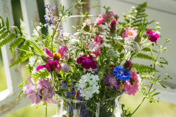 Fototapeta na wymiar Colorful wild flower bouquet in a summer garden