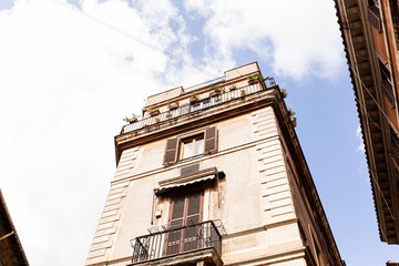 bottom view of buildings under blue sky in rome, italy