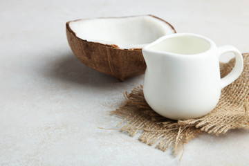 coconut and coconut milk in milk jug