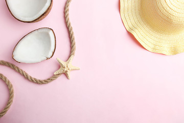 Fototapeta premium Pieces of natural coconut and beach straw hat
