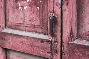 old wooden door with lock  craquelure cracked paint