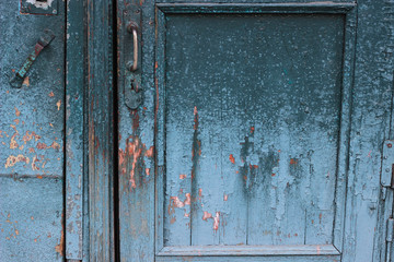 old wooden door with lock  craquelure cracked paint