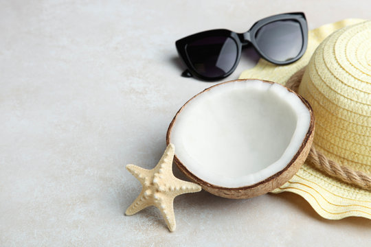 coconut, beach straw hat and sunglasses