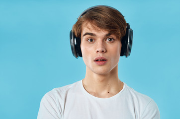 young man listening to music with headphones