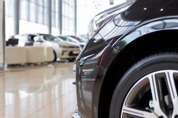 New cars at dealer showroom. For use as a background.