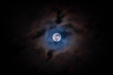 Full moon with clouds black background backdrop detail surface