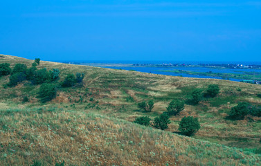 Fototapeta premium field hills view of the sea nature background