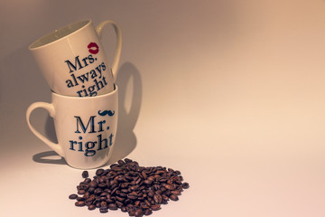 cup of coffee with beans on white background