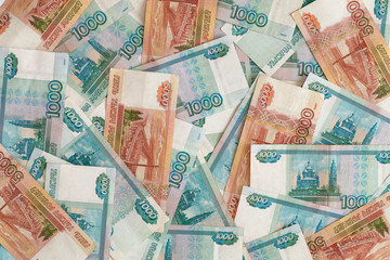 A lot of Russian money banknotes of roubles. Russian money background. Rubles banknotes closeup texture