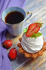 Fragrant tea and delicious cakes baskets of short pastry with jam and cream.