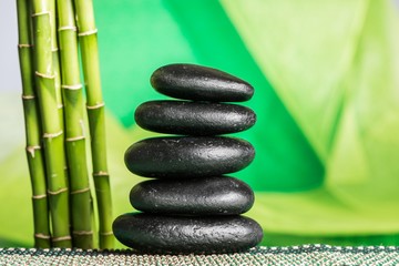 Fototapeta na wymiar Balancing Pebbles with Bamboo