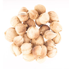heap of whites cardamom pods isolated on white background. top view