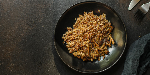 buckwheat porridge with mushrooms. food background. top view. copy space
