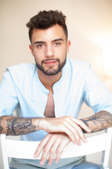 Fototapeta premium young tattoo man in a chair