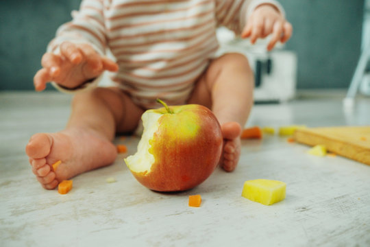 Baby eating an apple