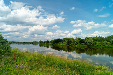 River in rural terrain at spring length of time