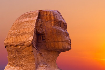 Sphinx against the backdrop of the great Egyptian pyramids. Africa, Giza Plateau.	