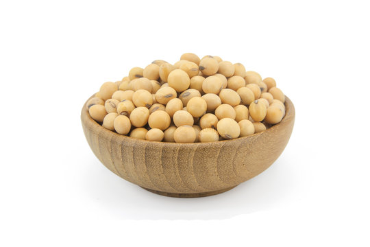 Soy beans in bowl wood isolated on white background with clupping path