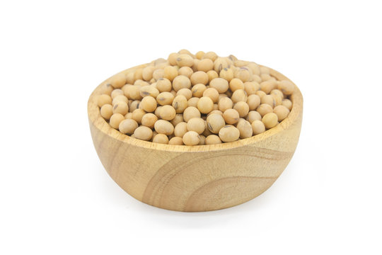 Soy beans in bowl wood isolated on white background with clupping path