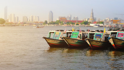 Fototapeta na wymiar Colorful Passenger Boats at Chao Phraya River, bangkok thailand.