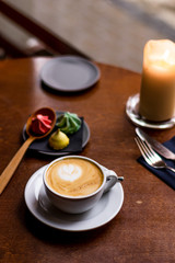 latte art heart with biscuits