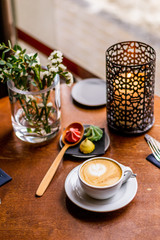 latte art heart with biscuits