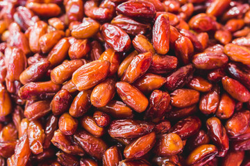 Dates are high in natural sugar - sweet fruits are packed with plenty of nutrients - excellent snack closeup of many dried dates - selected top-quality natural products