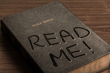 Dust on Bible with Words "Read Me!"