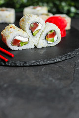 Sushi maki rolls (tuna, salmon, shrimp, avocado and other ingredients). japanese food. Top view, assorted sushi, you can eat menu. copy space