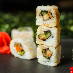 Sushi maki rolls (tuna, salmon, shrimp, avocado and other ingredients). japanese food. Top view, assorted sushi, you can eat menu. copy space