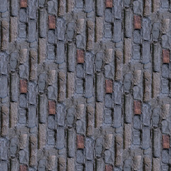 Seamless photo pattern of of fragment of broken grey wall.